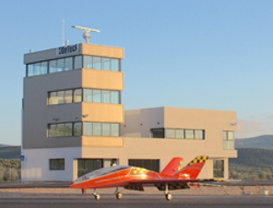 HARRIER Air Surveillance Radar installation at the ATLAS range control tower with remote controlled test drone on the runway.