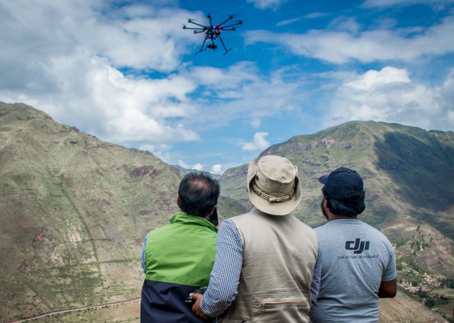 Members of Peru’s Ministry of Culture drone team watch a DJI S1000 octocopter in flight at the ruins of Pisaq in the Sacred Valley in April 2015.