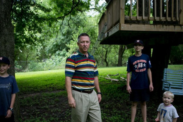 revor Tasin with three of his sons: John, 11; Ben, 13; and Dominic, 2. Mr. Tasin, a pilot who retired as a major in 2014 after flying Predator drones and training new pilots. Credit Ilana Panich-Linsman for The New York Times