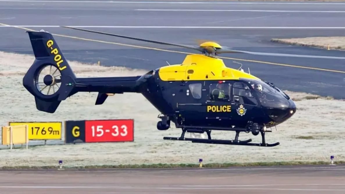 Police Helicopter Chasing Drones Near US Air Base  in Near Miss with F-15