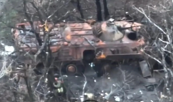 An Explosives-Laden Ukrainian Drone Follows Russian Troops into a Wrecked Armoured Vehicle